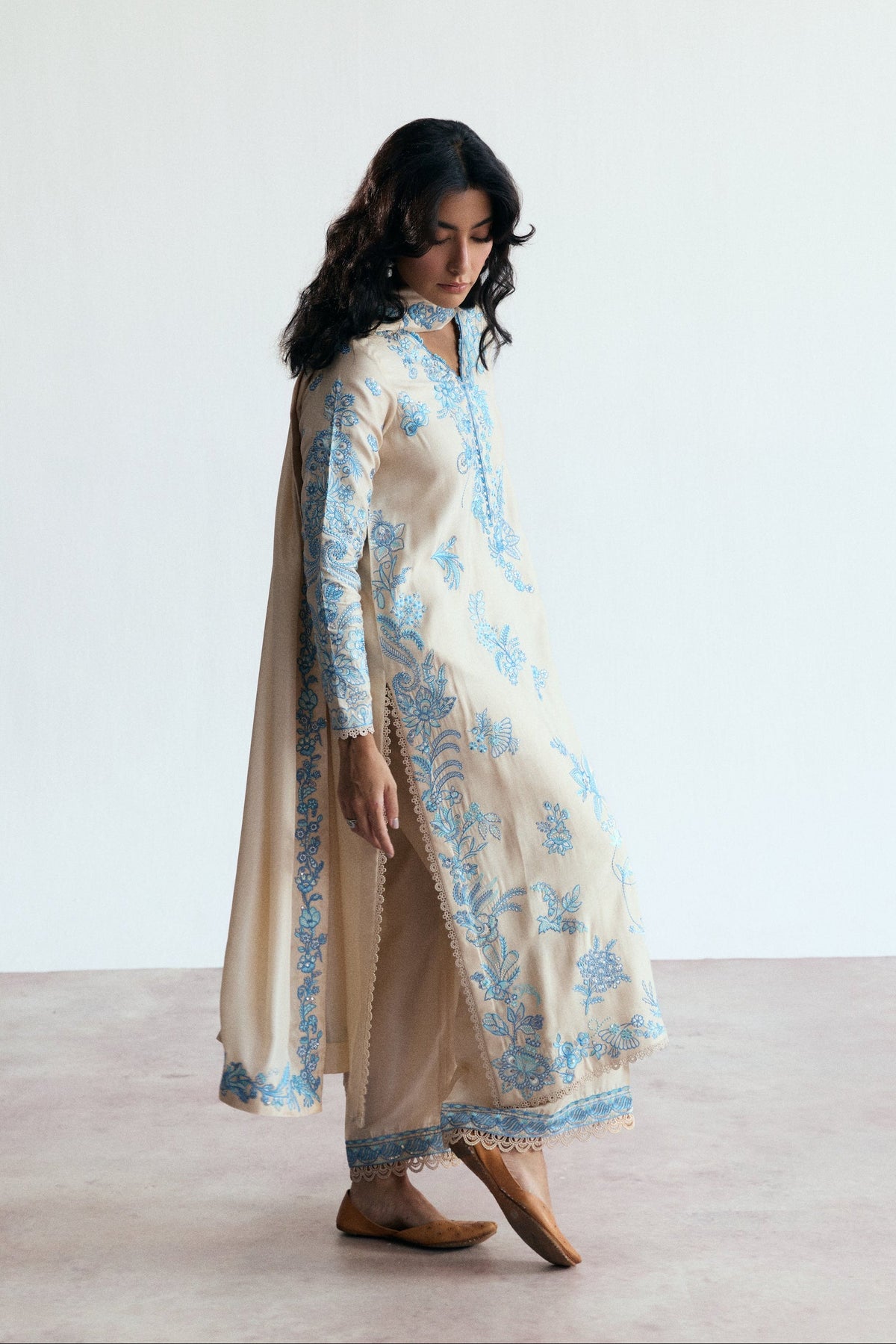Side view of the Opalite Set showing lace trims along the side seams and hem of the cream shirt.