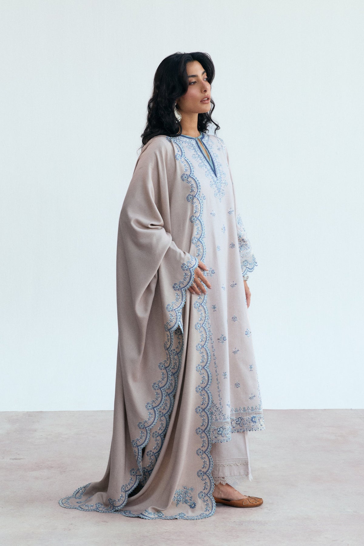 Elegant khaddar oat Pakistani kameez with scalloped sleeves, looped lace side seams and embroidered floral shawl — winter ethnic wear UK