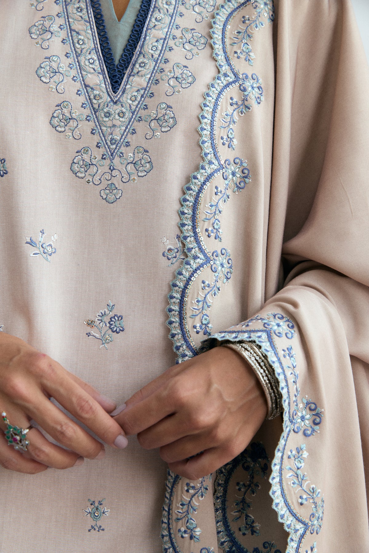 Creamy oat khaddar Pakistani kameez with scalloped lace sleeves and embroidered floral four-corner shawl — winter festive outfit UK