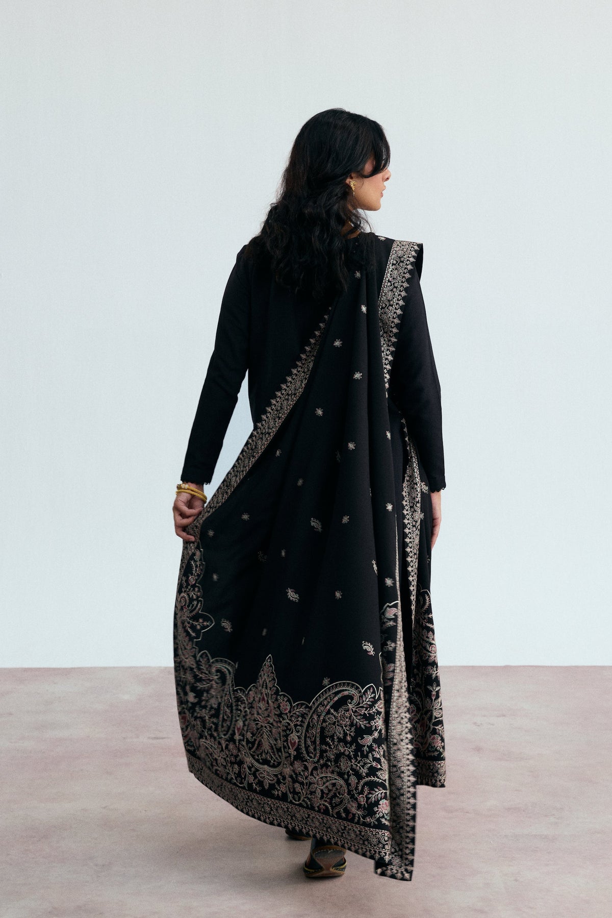 Luxury black khaddar long kameez with pastel keyhole embroidery and tapered lace sleeves — Pakistani winter outfit UK