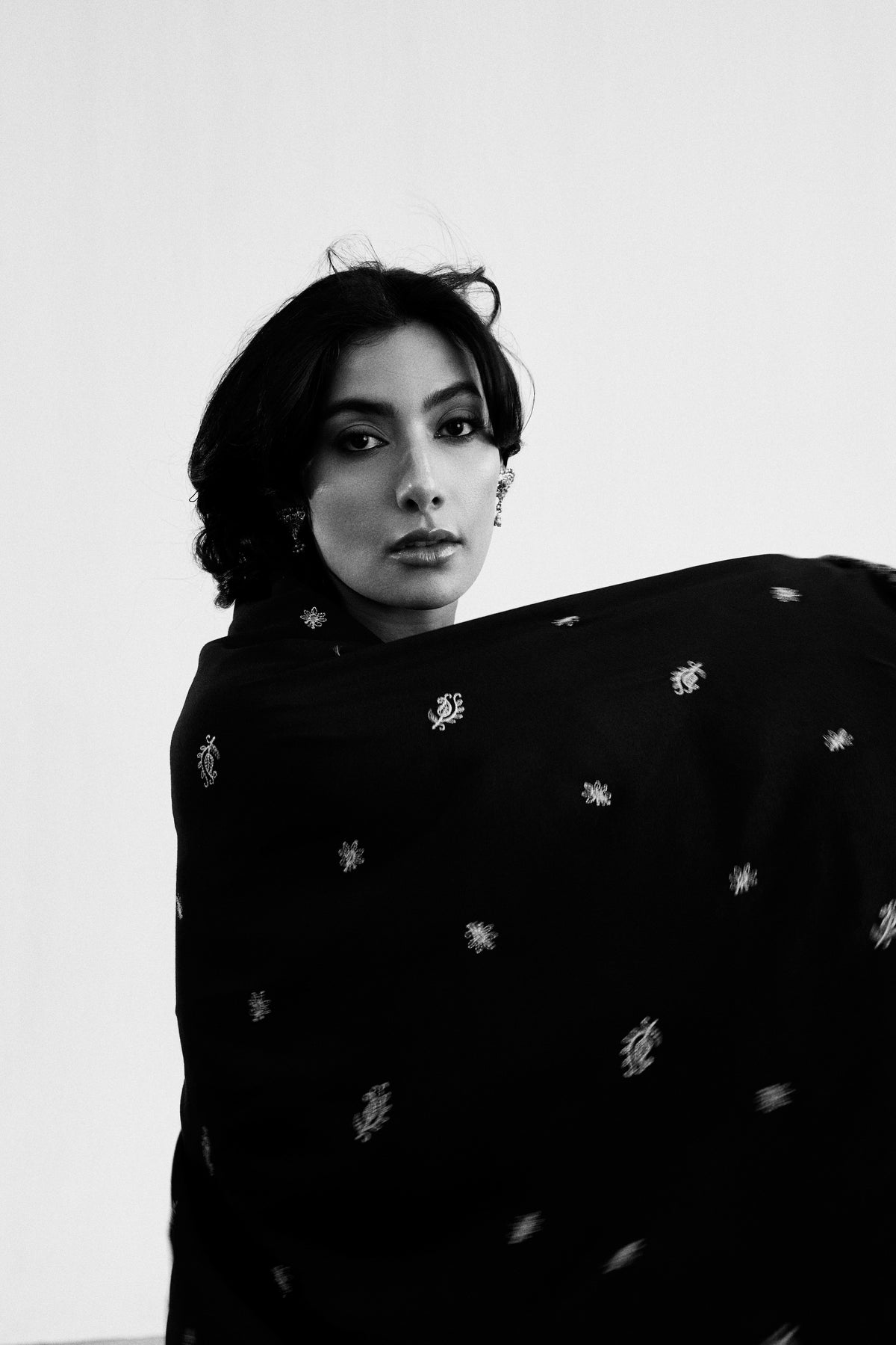 Women wearing Mannam Midnight black khaddar Pakistani suit with embroidered shawl — casual and semi-formal occasions UK