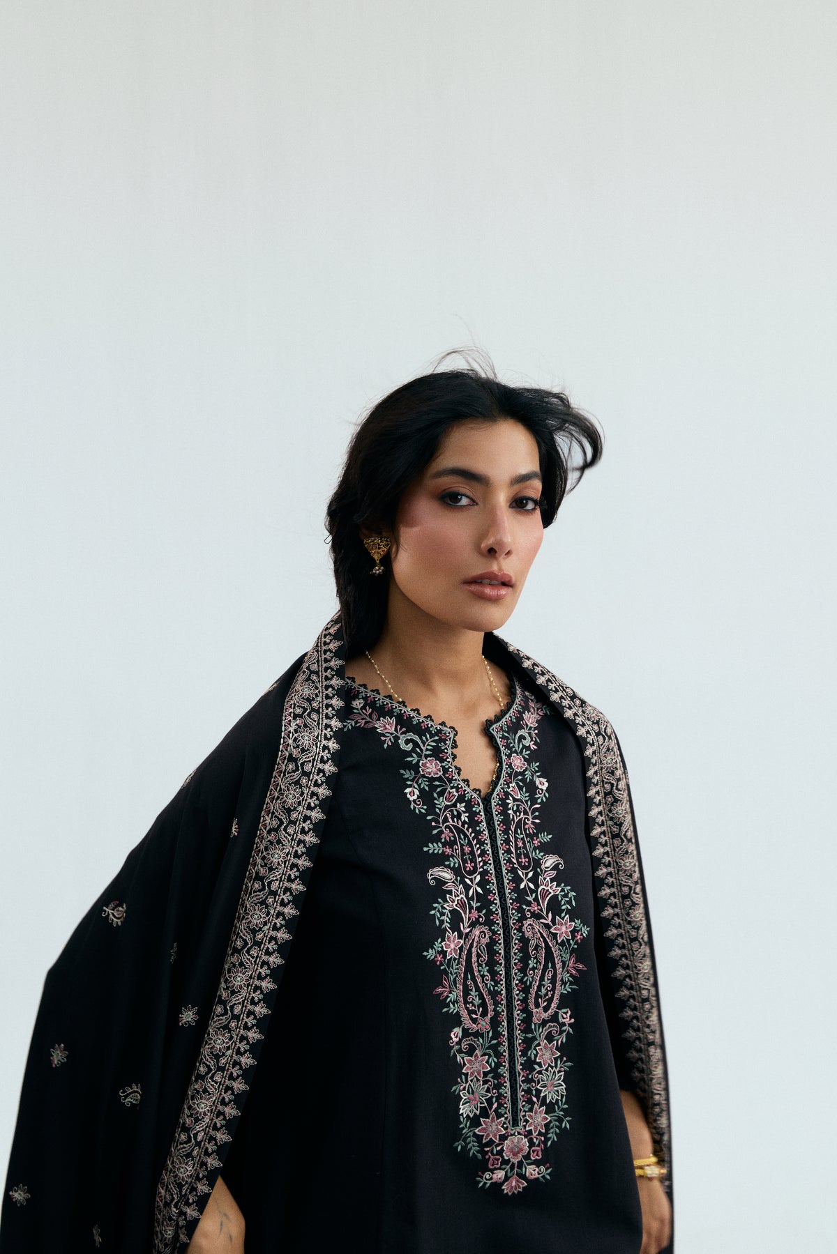 Full-length view of Mannam Midnight Set — black khaddar winter three-piece with pastel embroidery and embroidered viscose shawl