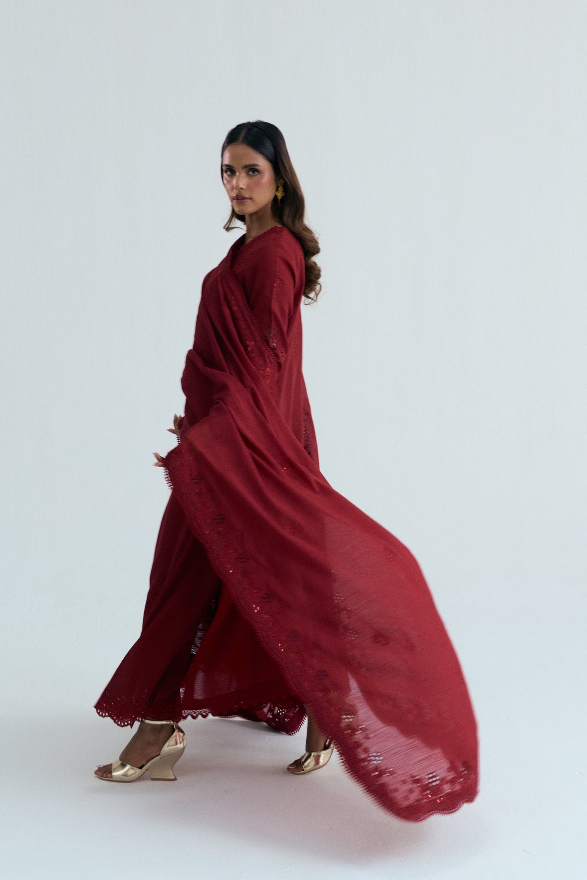 Maroon Pakistani khaddar three-piece suit Paired with scalloped embroidered izaar trousers for a refined finish.
