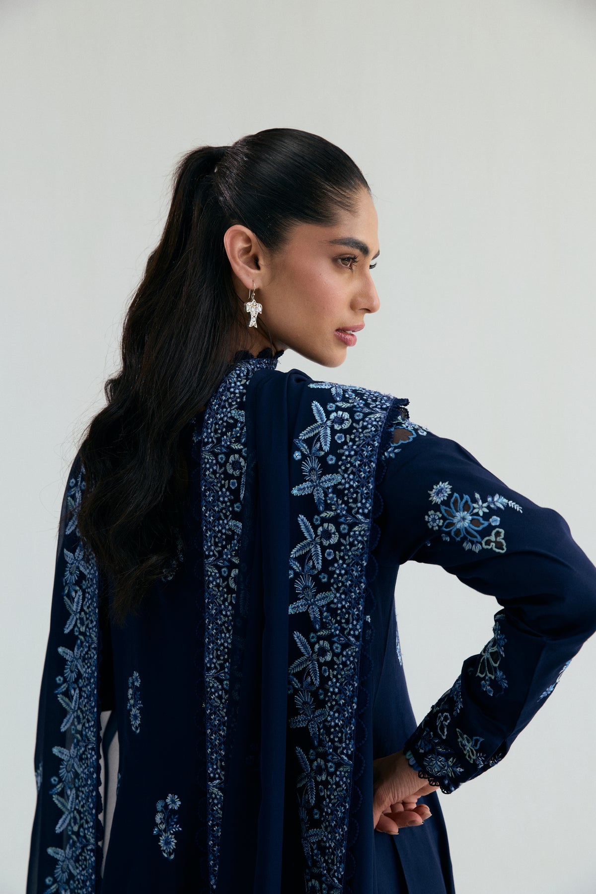 Elegant sapphire blue Pakistani Kalidaar suit with flared silhouette, pencil trousers and sequin chiffon dupatta
