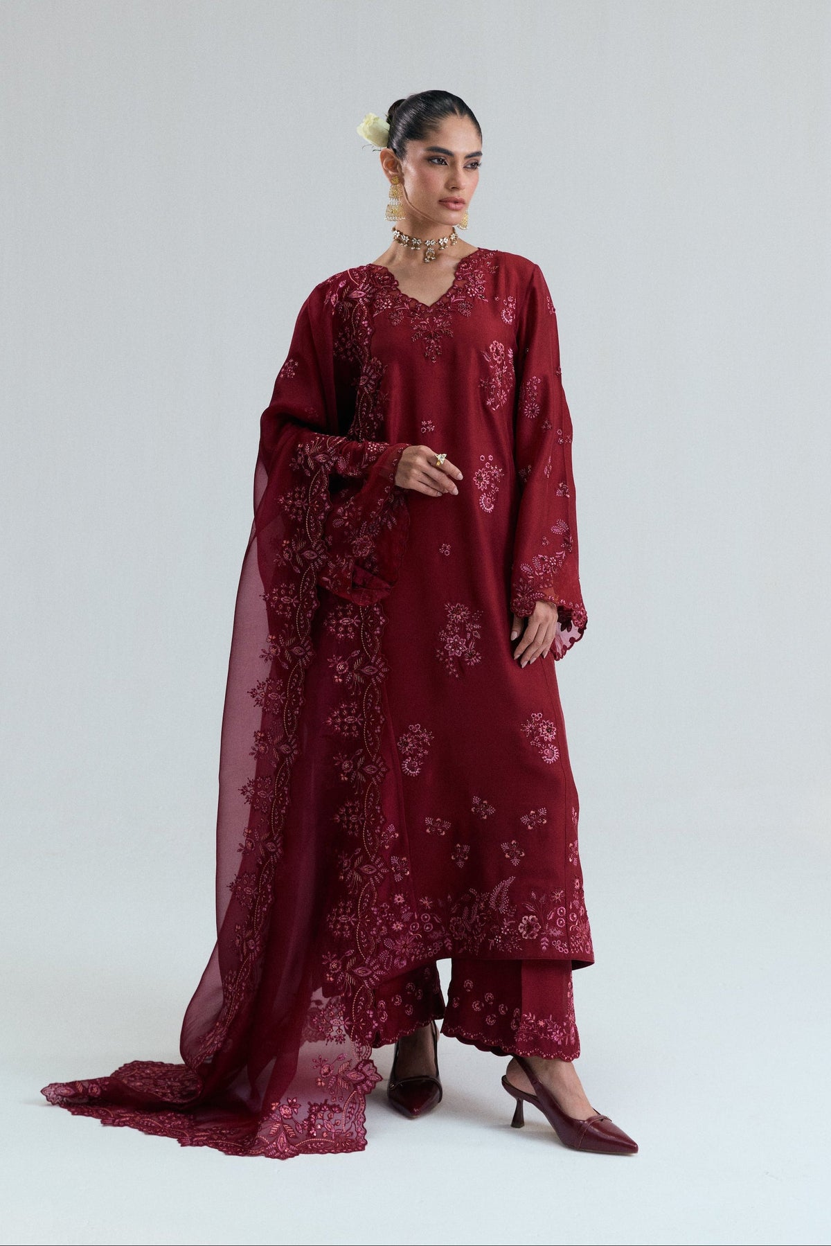 Full-length maroon raw silk Pakistani long kameez with side-slit straight leg trousers and sequin embroidery