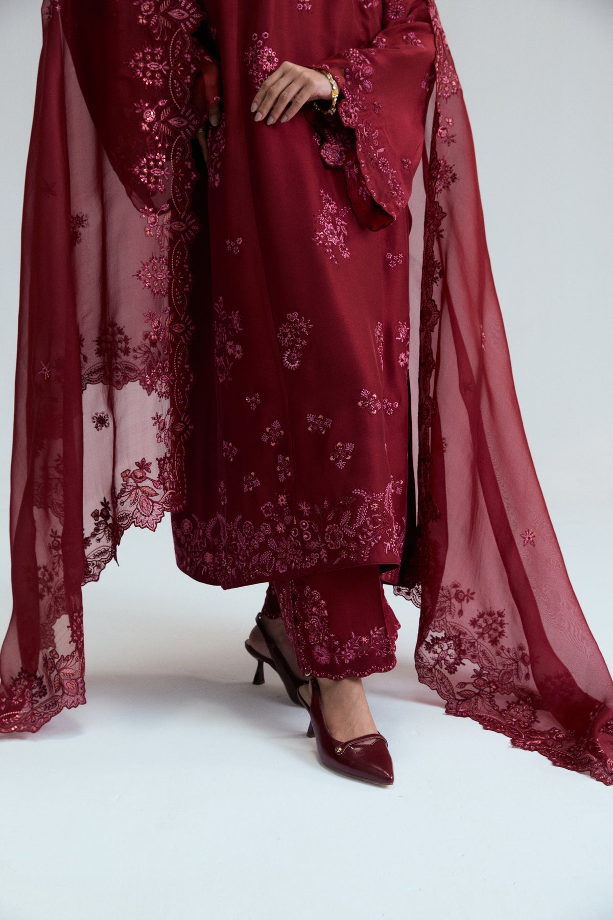 Women wearing Mannam Cranberry Set — maroon raw silk kameez with sequin beadwork for Pakistani formal occasions