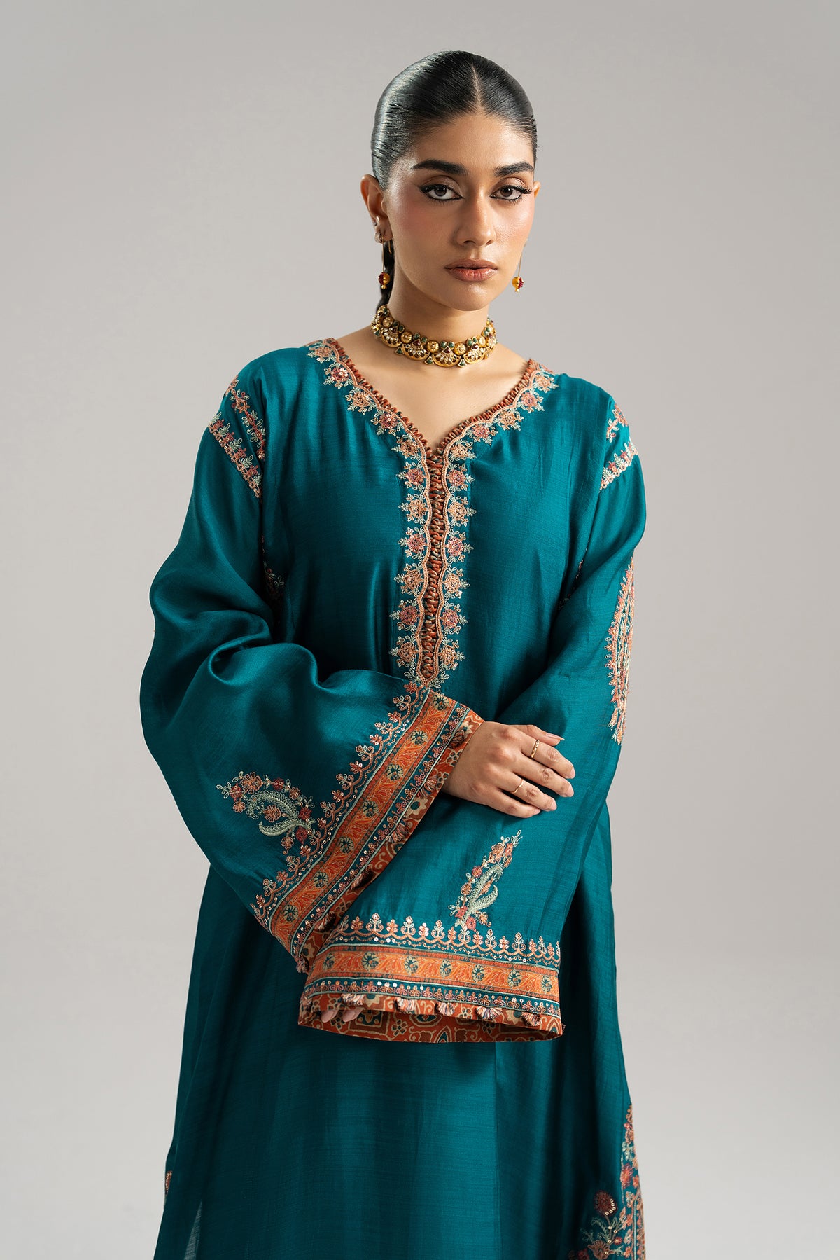 Side view of Afroz teal phiran showing ajrak print facing along hem and sleeves — Pakistani Kashmiri-style dress UK