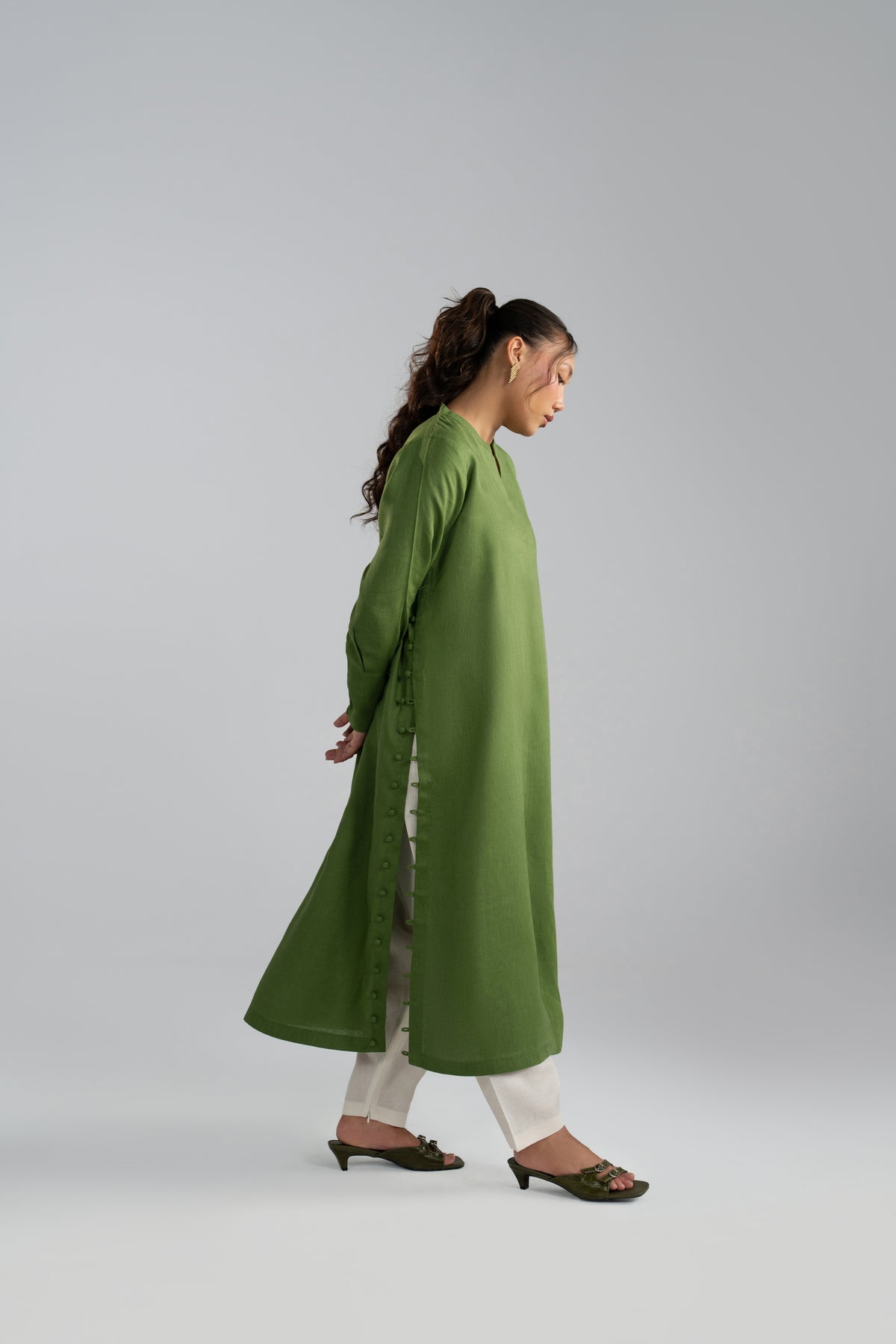 kameez in motion, front slit and white shalwar visible while walking