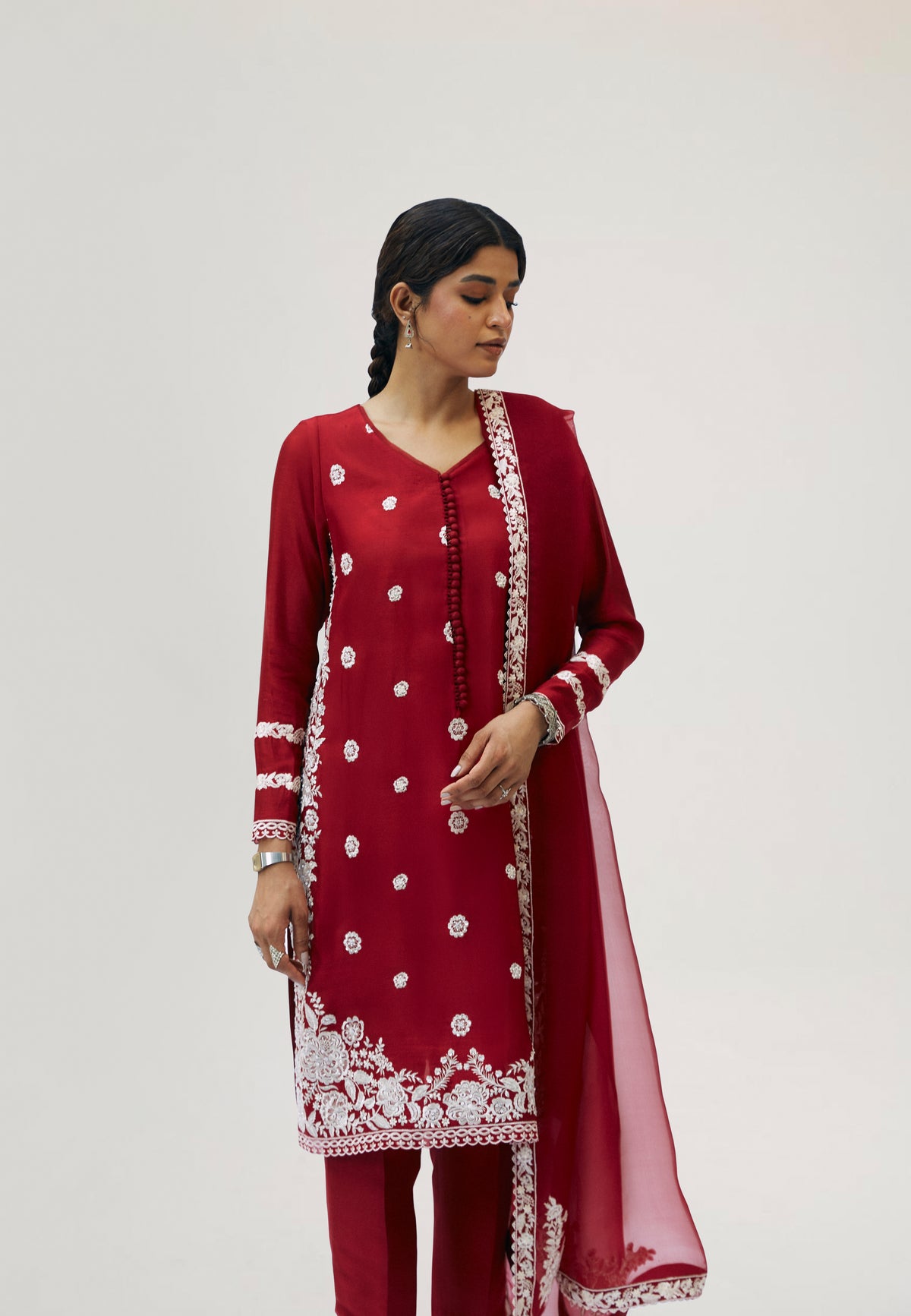 Side view of crimson silk Pakistani kameez with floral motifs and scalloped sleeve design — luxury ethnic wear UK