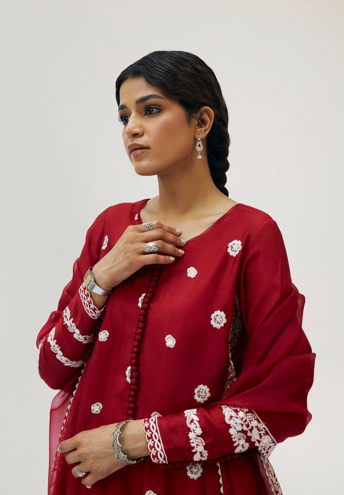 Elegant crimson silk Pakistani kameez with floral motifs throughout — formal and festive South Asian wear