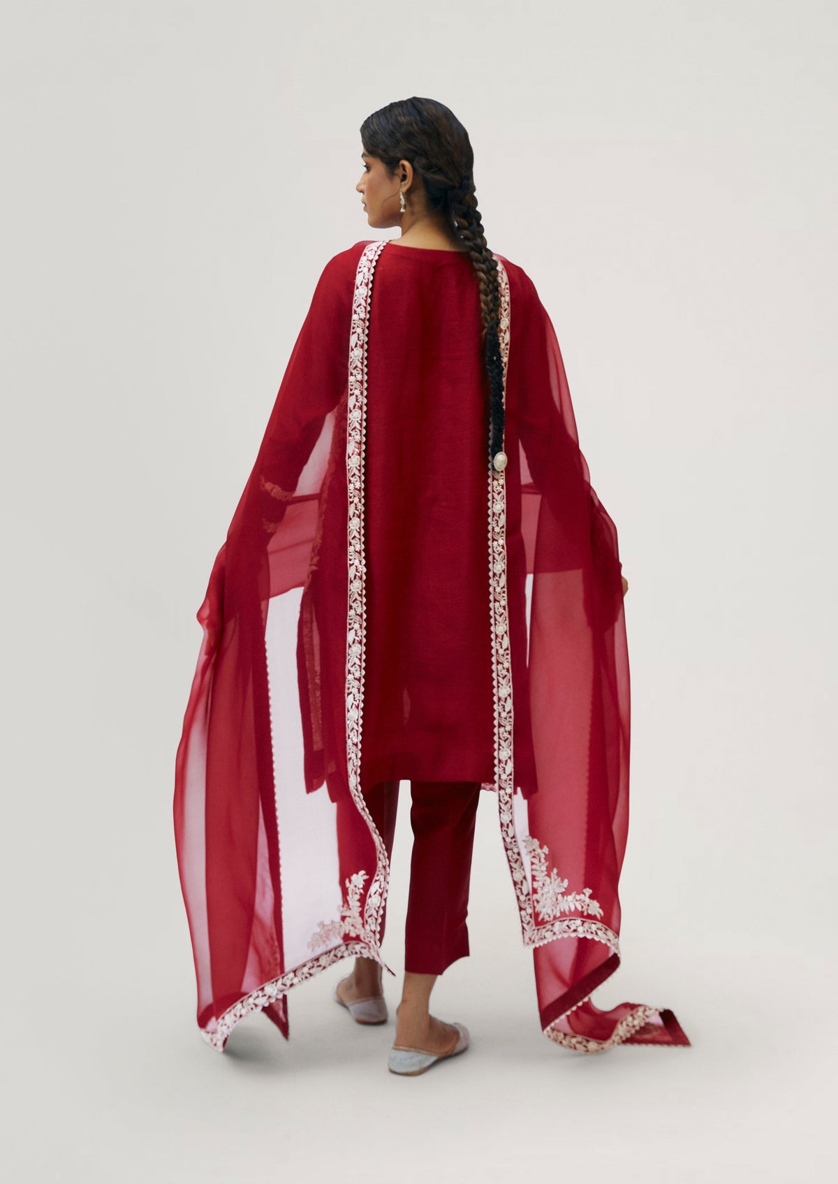 Women wearing Mannam Crimson Set — crimson silk embroidered kameez with tapered trousers and organza dupatta