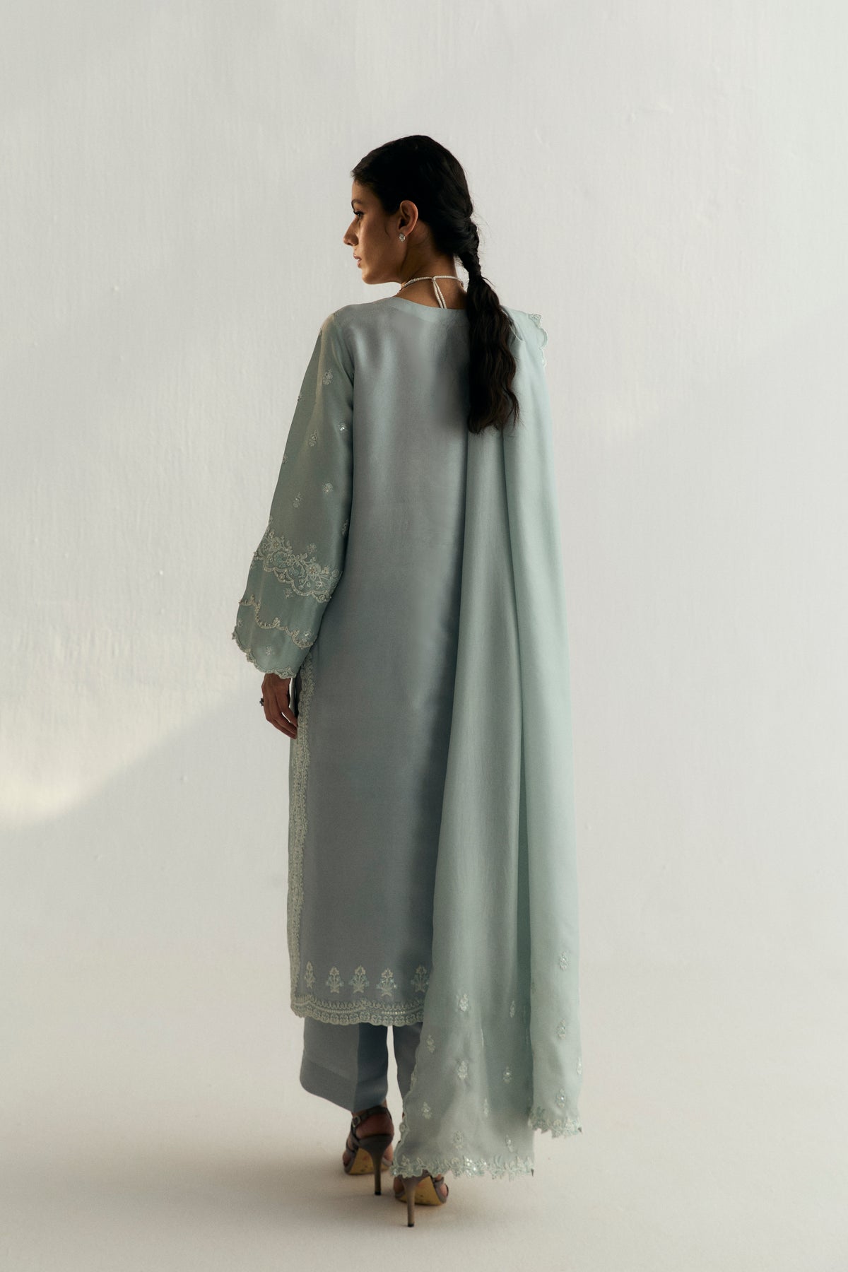 Modern Pakistani designer outfit with scalloped hem and silk dupatta