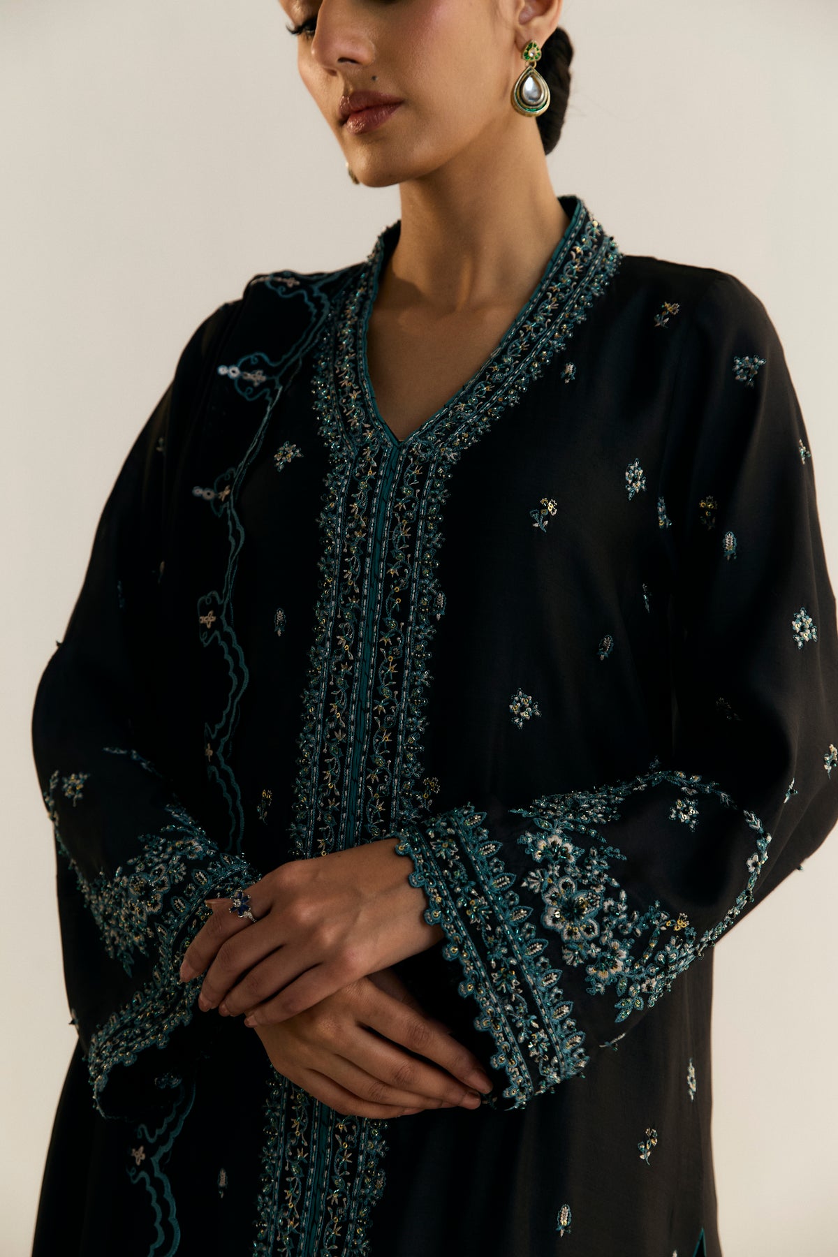 Side view of Onyx black khaadi silk jacket kameez with open-bottom silhouette — designer Pakistani formal dress UK