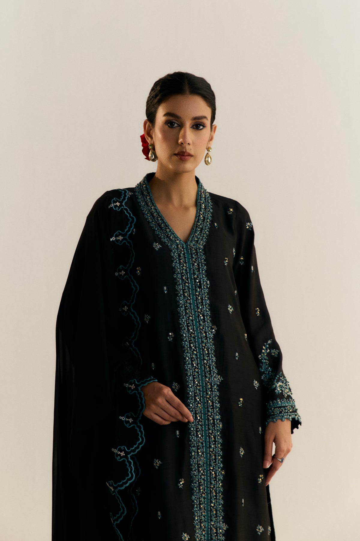 Premium black khaadi silk Pakistani formal suit with uniquely-cut hem and raw silk trousers — wedding guest dress UK