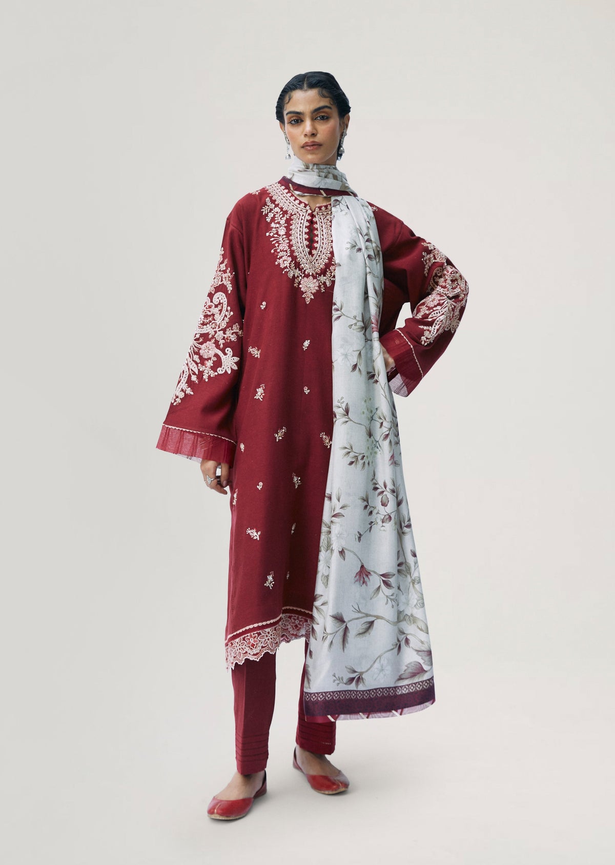 Women wearing Mannam Ruby Set — red embroidered cotton-rayon kameez with pintuck trousers for Pakistani occasions