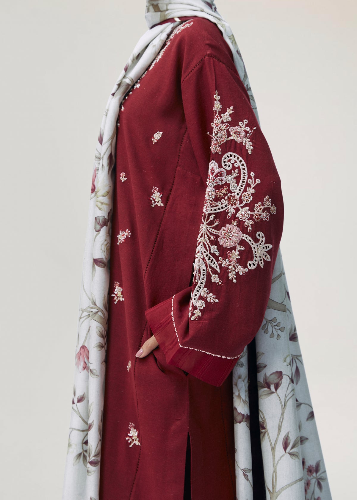 Detail of hand-embellished keyhole neckline on red Pakistani cotton-rayon kameez by Mannam