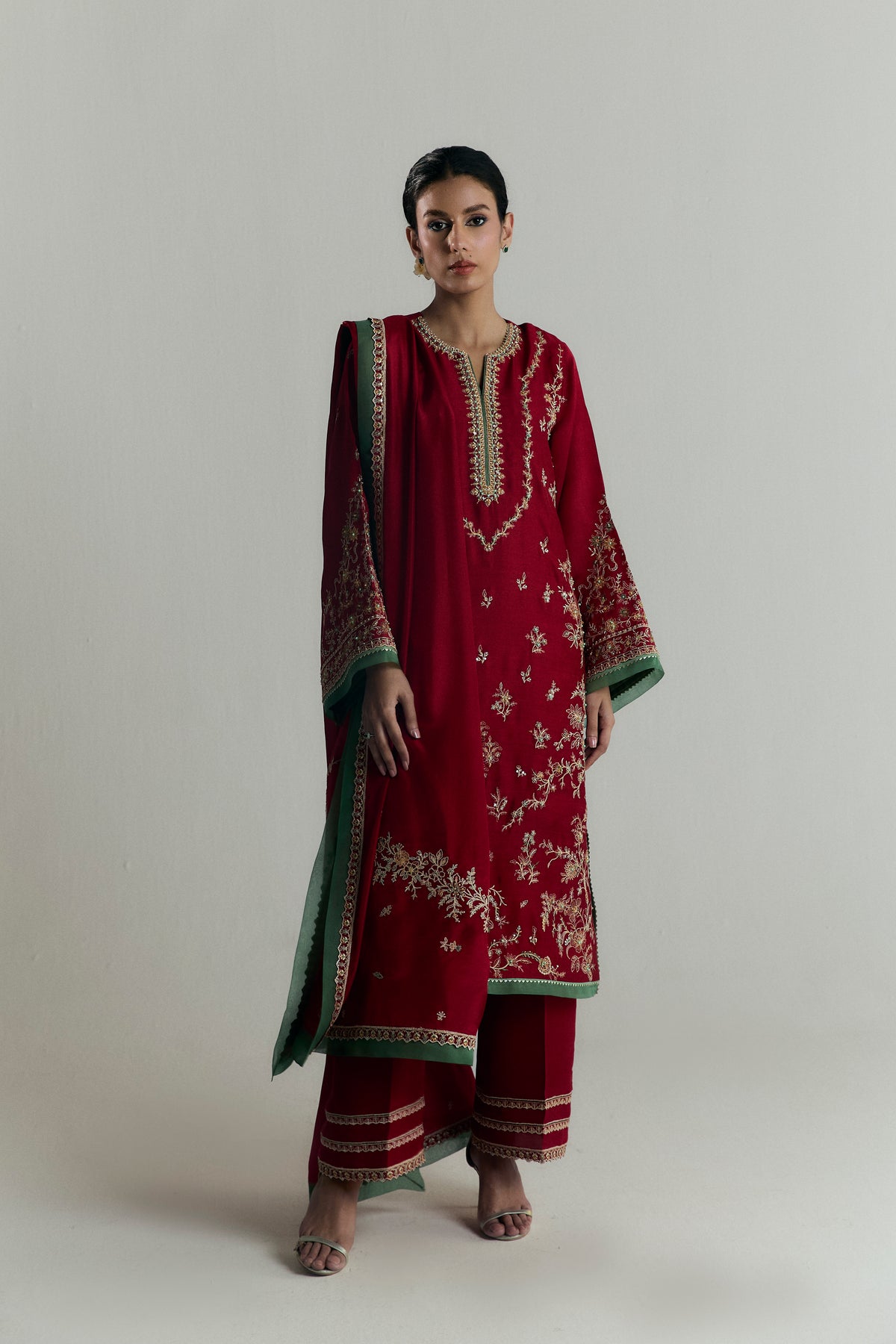 Mannam Scarlet Set — scarlet red khaadi silk kameez with gota embroidery and green accents, wide-hem pleated trousers, Pakistani formal wear UK