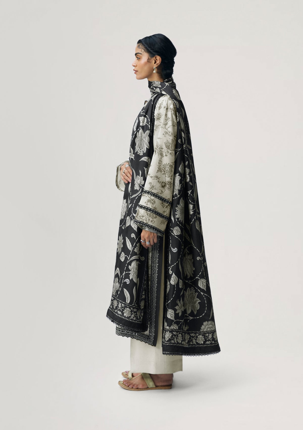 Black and cream Pakistani silk suit with modern boat neck V-cut and hand-embroidered hem — designer formal dress UK