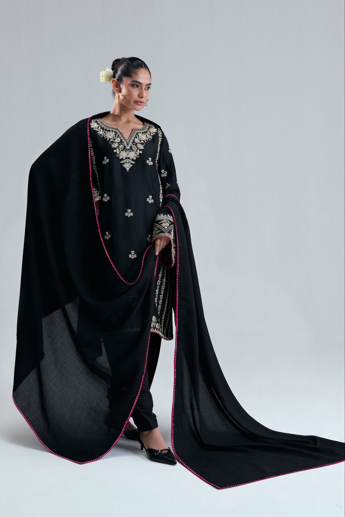 Starlight Set by Mannam featuring a black raw silk phiran with colorful flowers and pink edges.