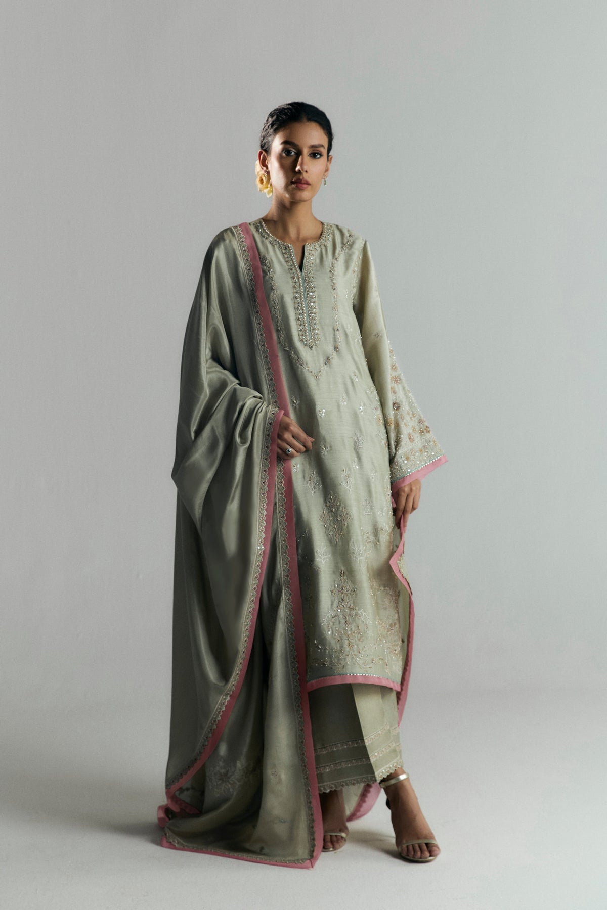 Khaadi silk kameez detail — contrasting organza finishings and gota embroidery at hem