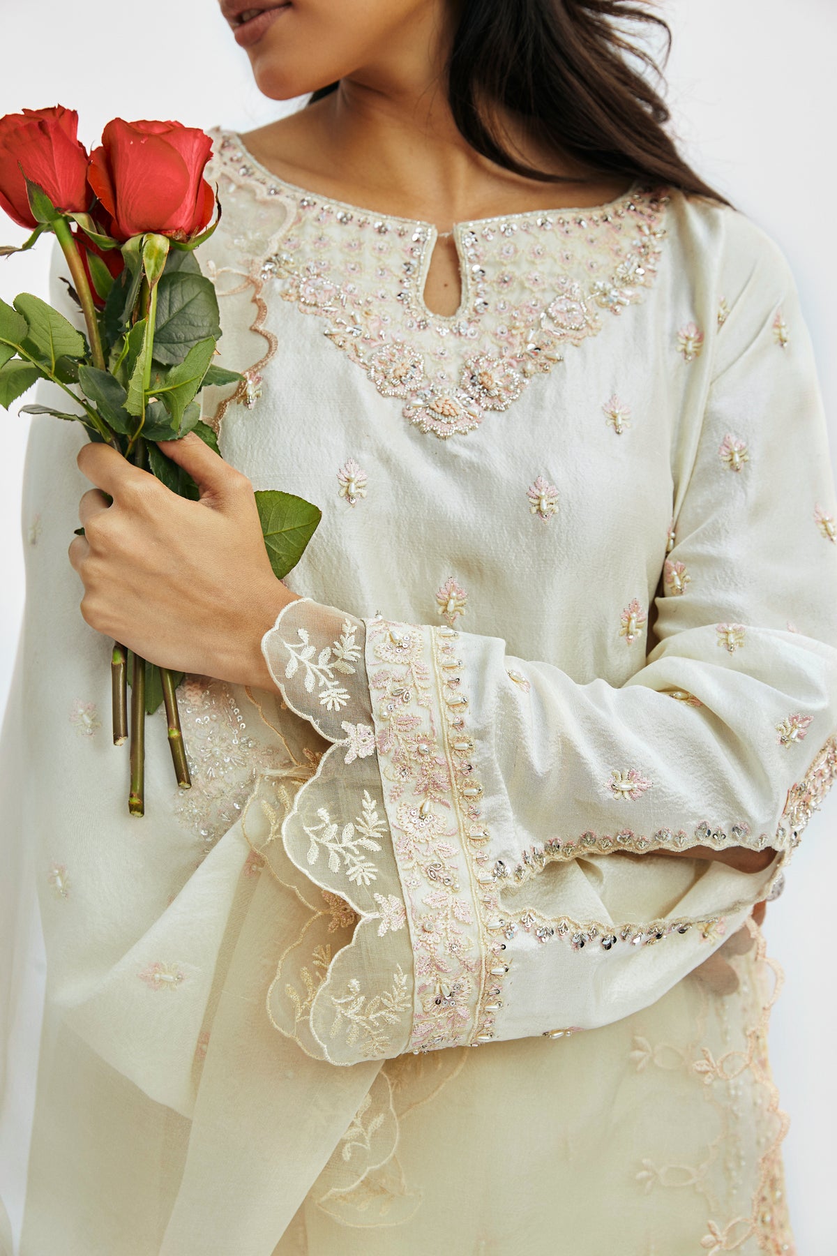 Hand-embellished raw silk off-white traditional Pakistani outfit with keyhole neckline — wedding and formal wear by Mannam