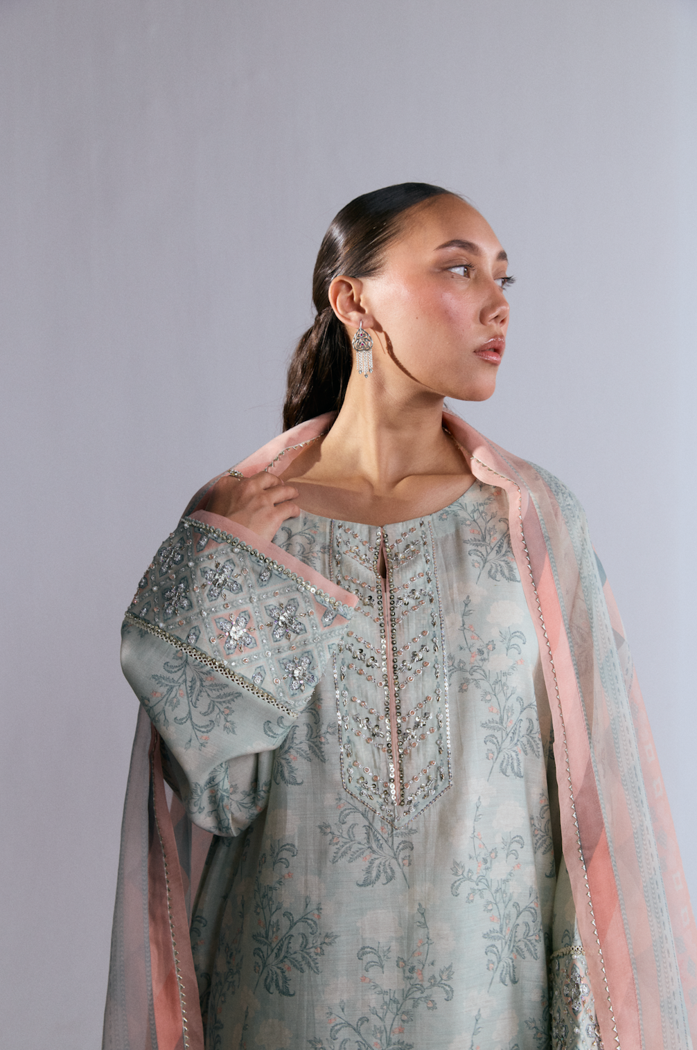Floral silk kameez detail — hand embellishments on neckline and sleeves