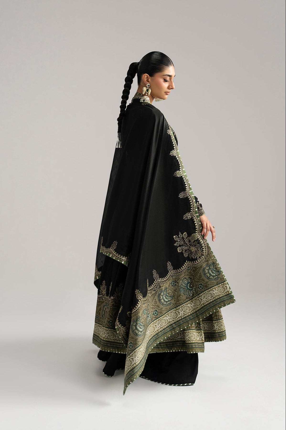 Pakistani anarkali close-up — scalloped tilla and sequin embroidery on border