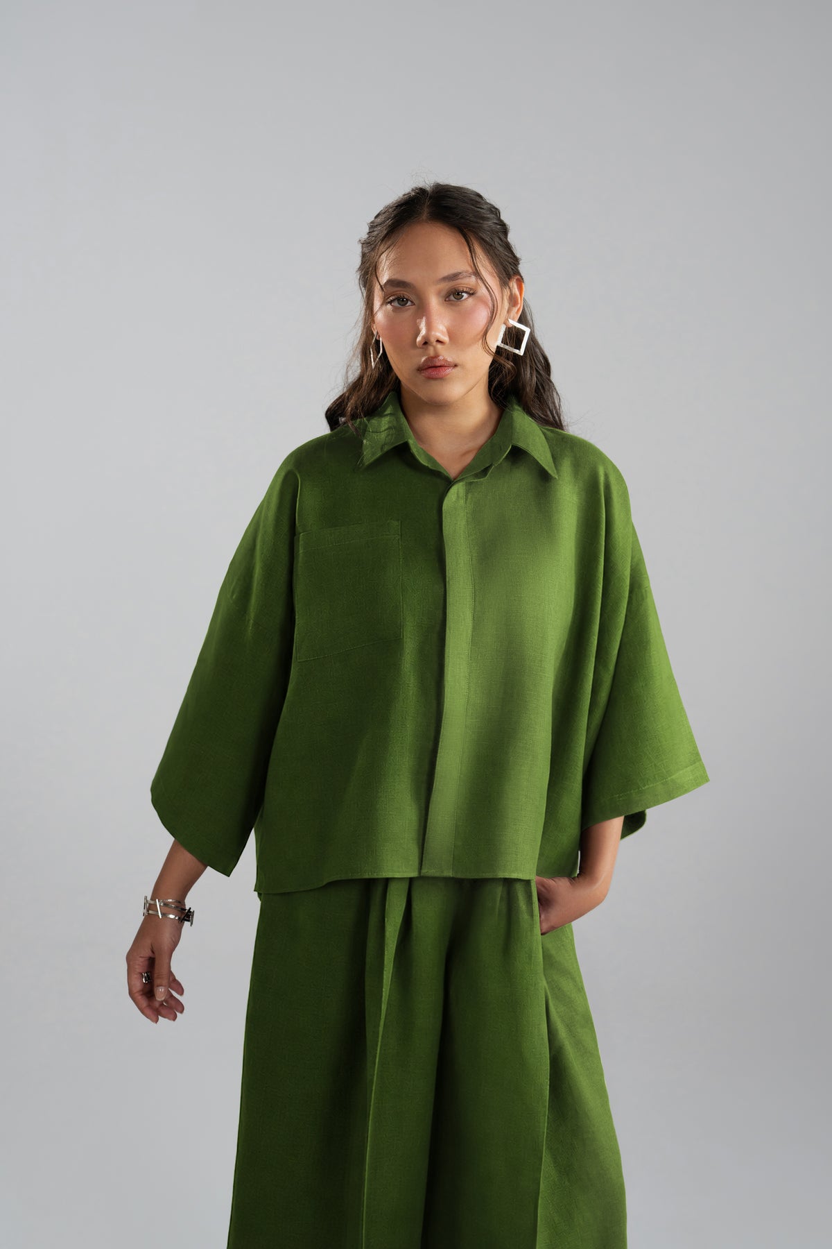 Aspen Set front view, green loose-fit shirt and trousers