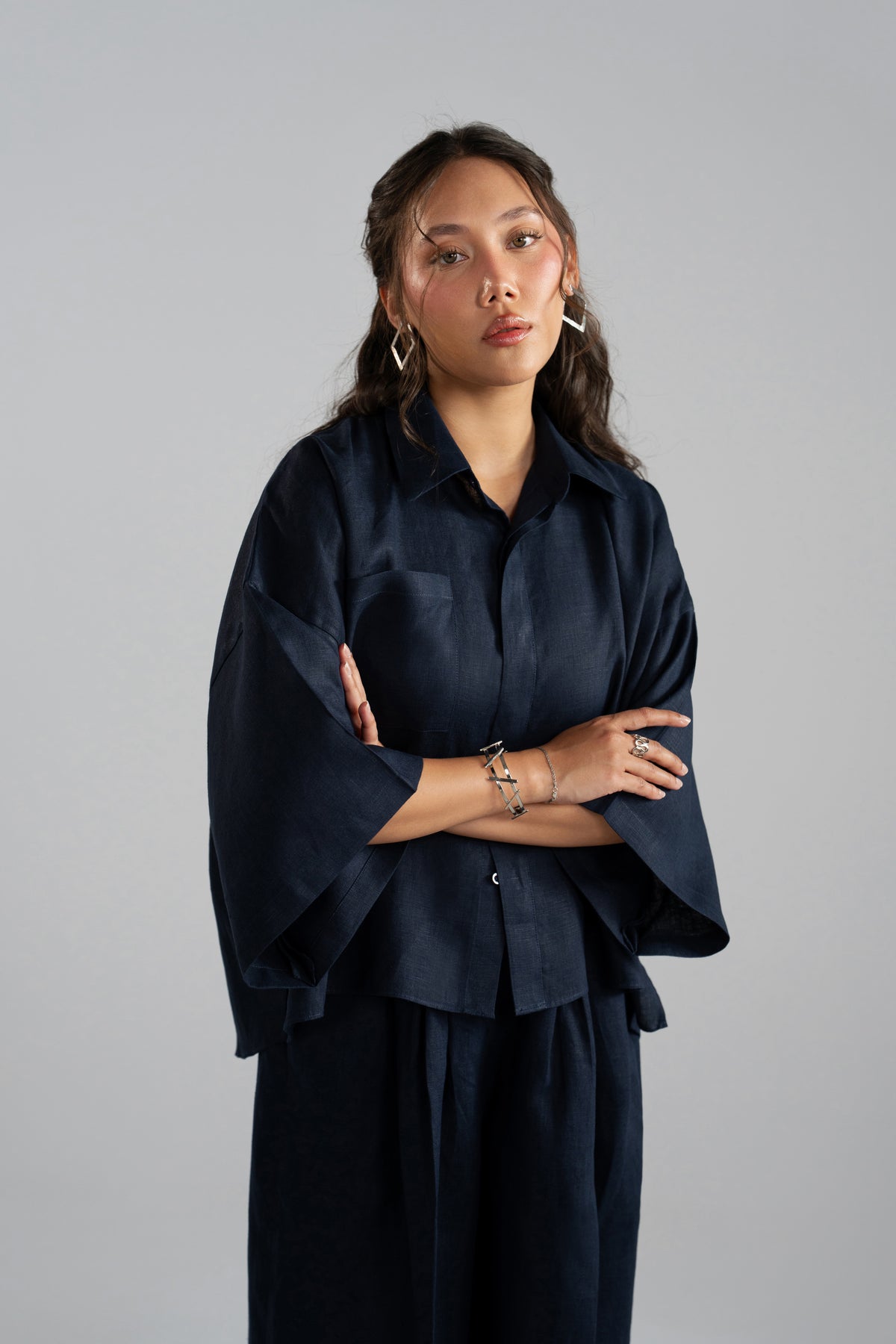 Close-up of Indigo Set button-down collar and cropped shirt hem