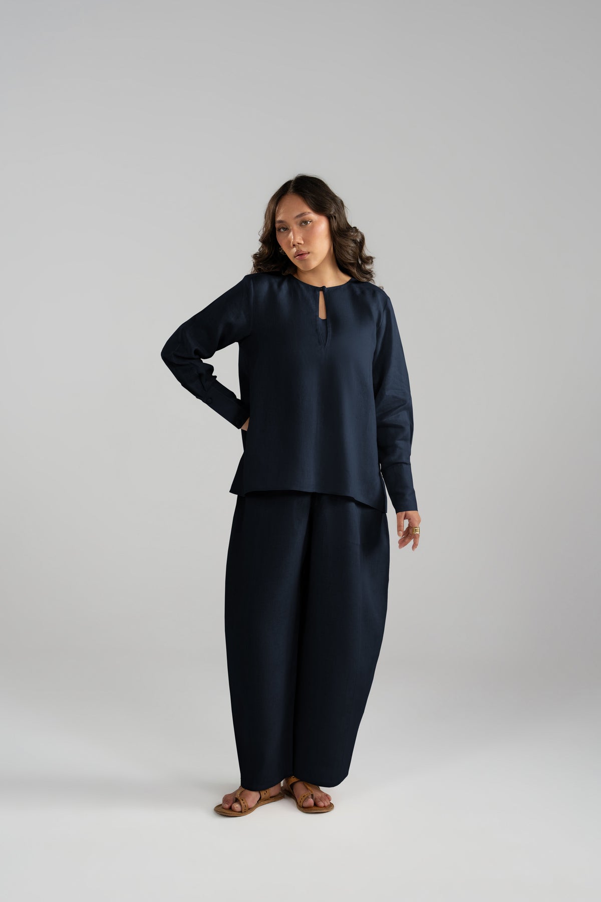 linen three-piece suit with a short keyhole-neckline shirt, gathered sleeves, panelled balloon trousers