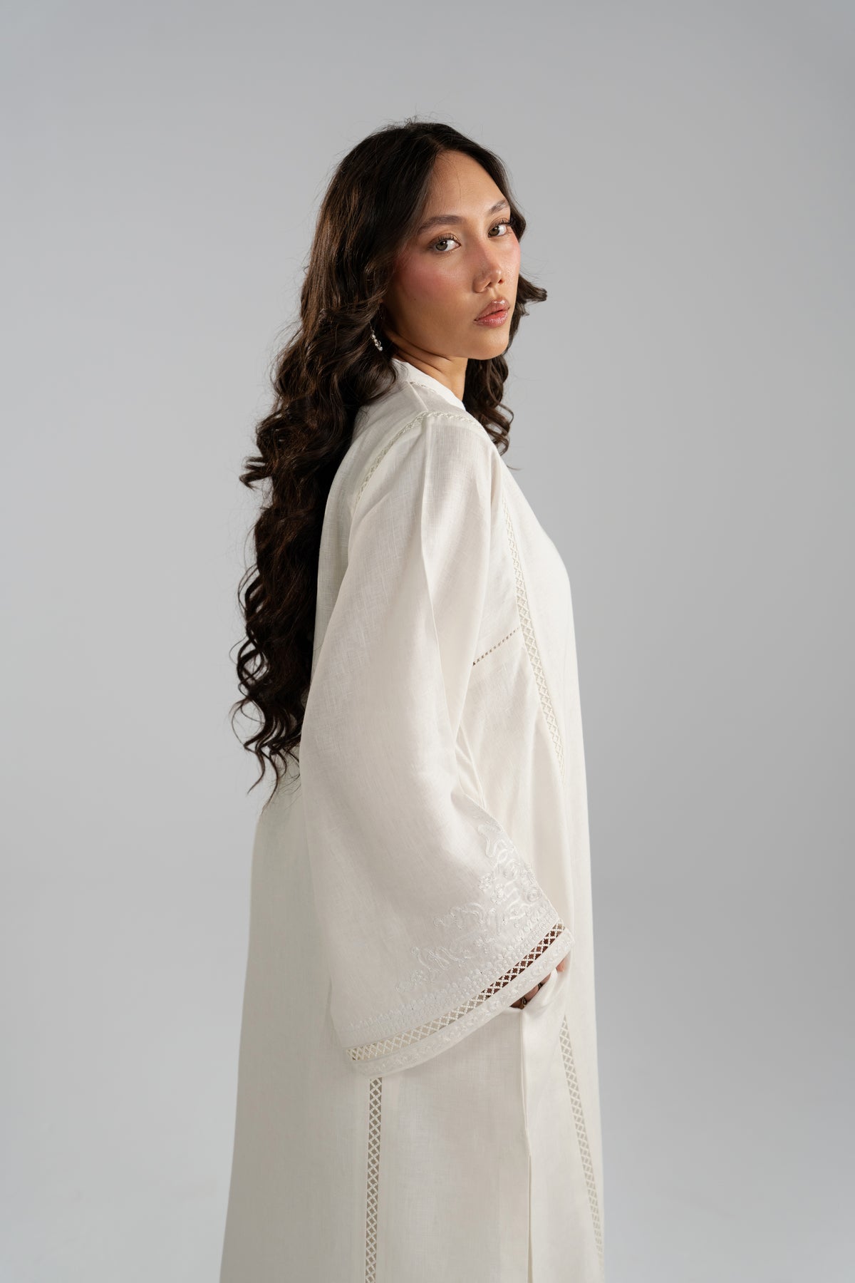 Side profile of Noor Set showing embroidered cuff and hem lace