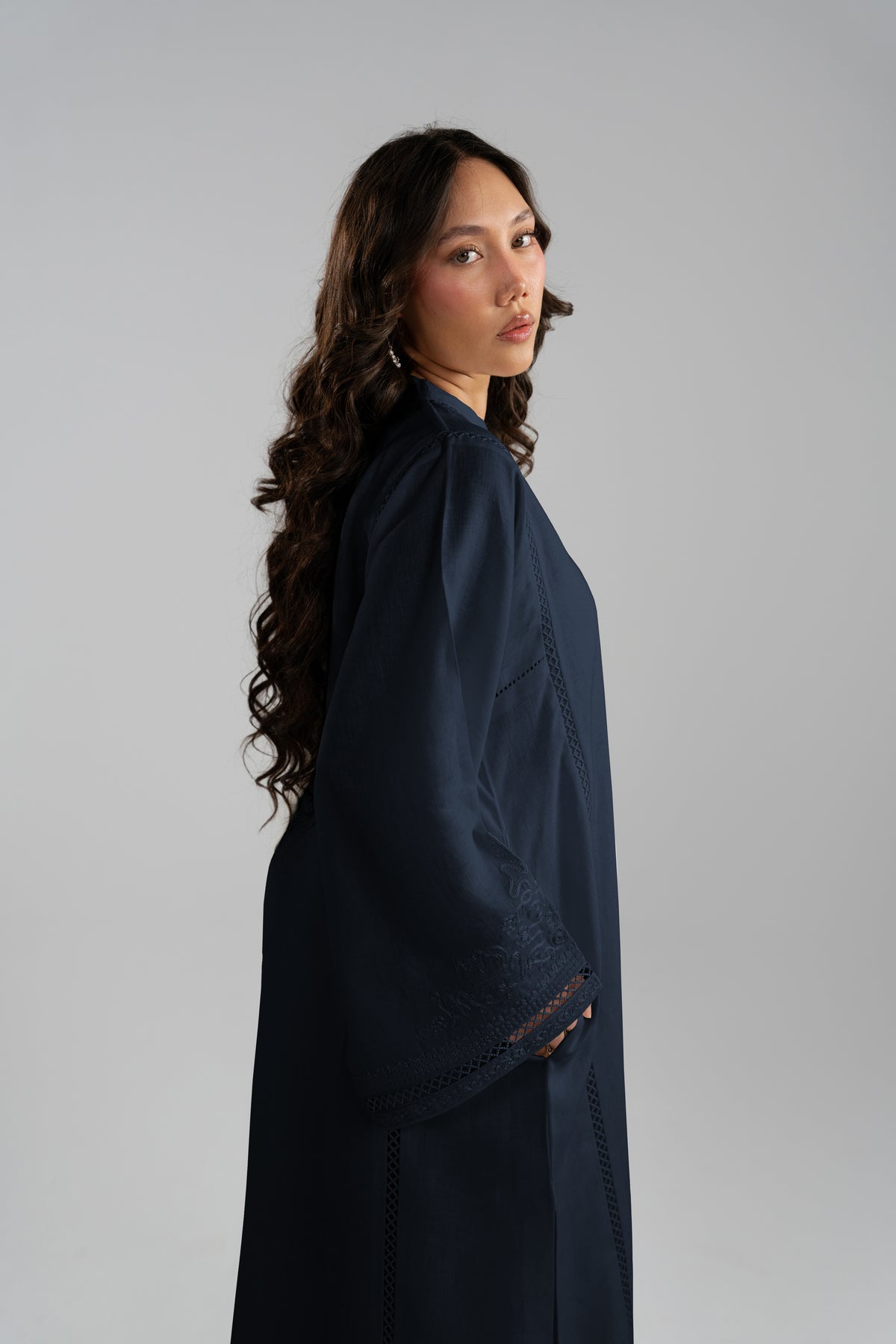 Side profile of Nova Set showing embroidered cuff and hem lace