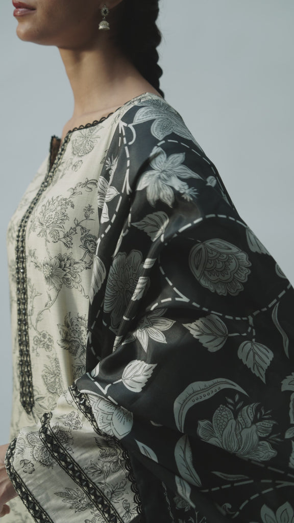 Video of Mannam Black and Cream Set — pure silk Pakistani kameez with mirror work neckline, hand embroidery and cream printed dupatta