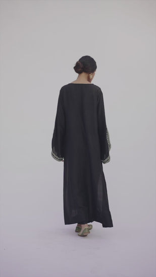 Video of Mannam Black Phiran Set — black raw silk Pakistani phiran with hand-embroidered V-neckline and raw silk trousers