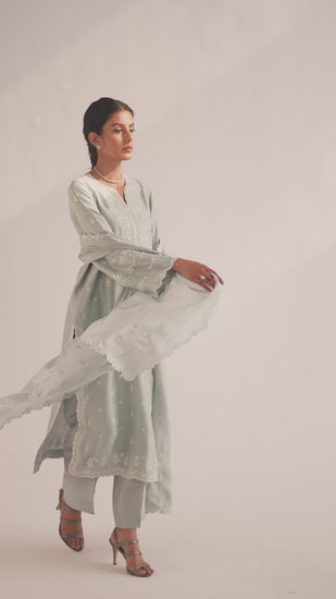 Light blue luxury pret wear Pakistani suit with handwork detailing
