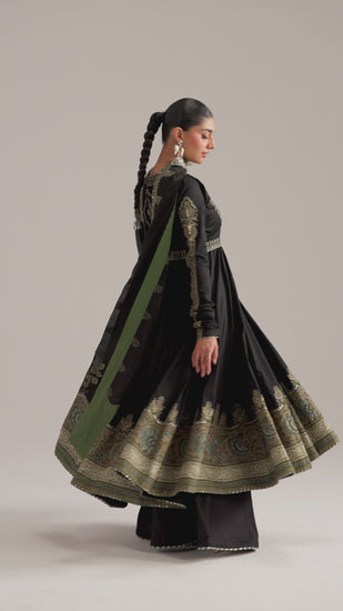 The Sunstone Set by Mannam is a Pima cotton anarkali featuring scalloped tilla and sequin embroidery, an embroidered koti jacket, wide-leg chatta patti trousers and a scalloped dupatta with intricate pallu work.