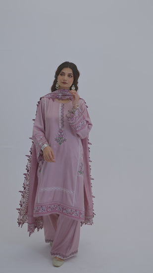 The Lavender Set by Mannam is a pure silk kameez in soft lavender with hand embroidery on the neckline, sleeves and hem, paired with pure silk trousers and a pure silk dupatta with an embroidered border.