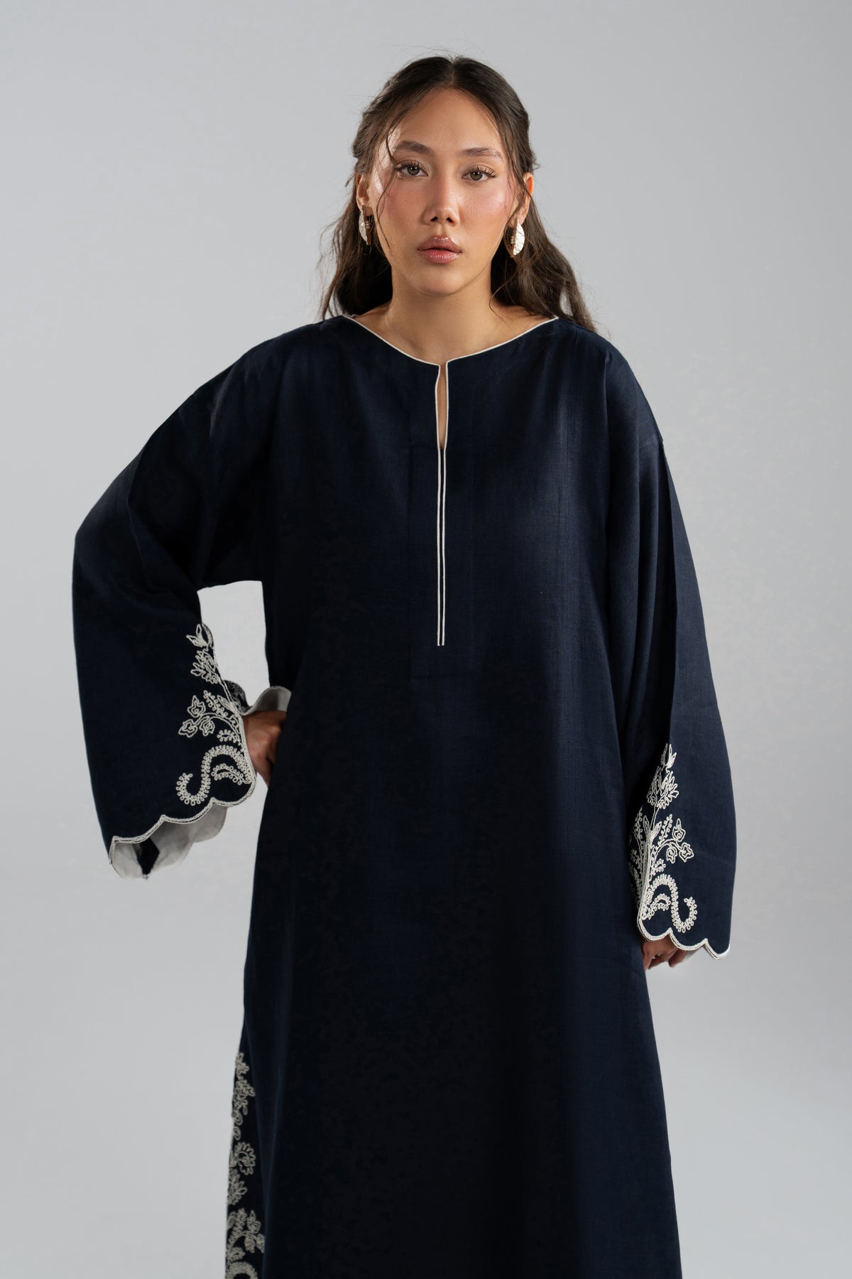 Close-up of Selene Set kaftan neckline slit and embroidered sleeve